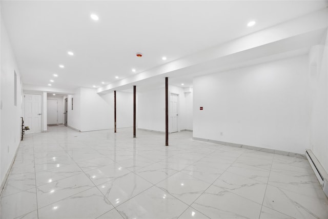 finished basement with marble finish floor, baseboards, baseboard heating, and recessed lighting