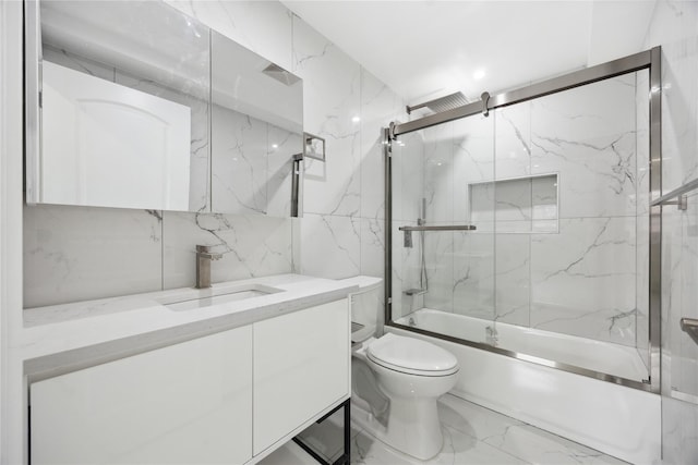 full bathroom featuring enclosed tub / shower combo, marble finish floor, toilet, and vanity