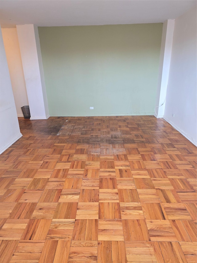 empty room featuring baseboards