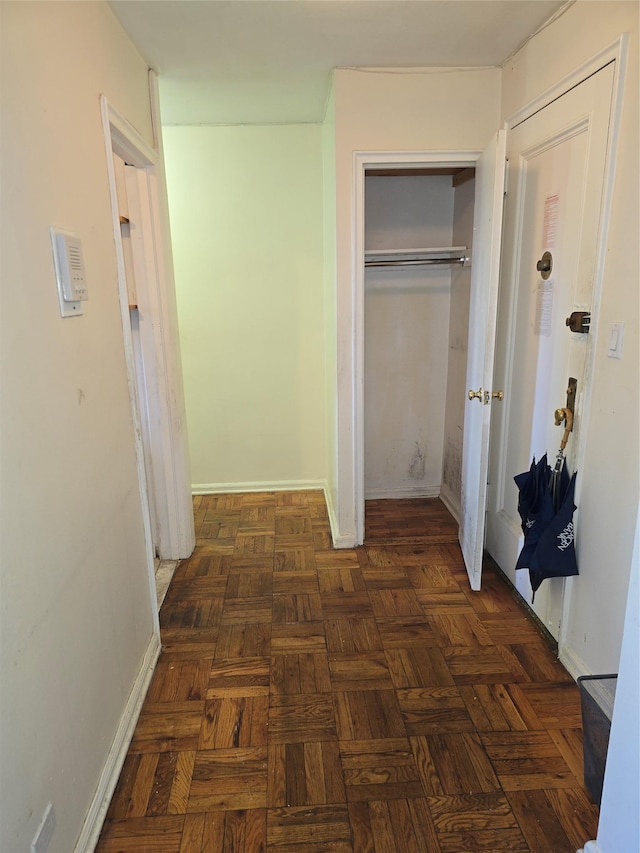 corridor featuring baseboards