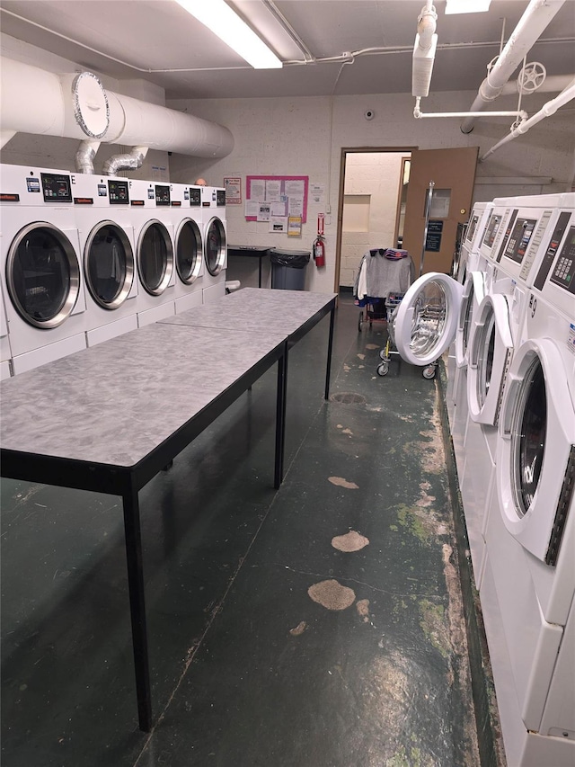 shared laundry area with separate washer and dryer