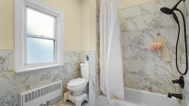 full bath with shower / tub combo, toilet, a wainscoted wall, radiator heating unit, and tile walls