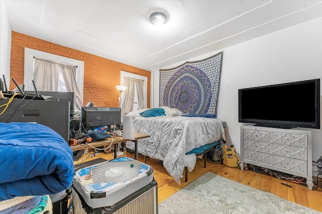 bedroom with wood-type flooring