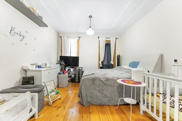 bedroom with wood-type flooring