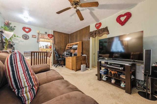 living area featuring light carpet and ceiling fan