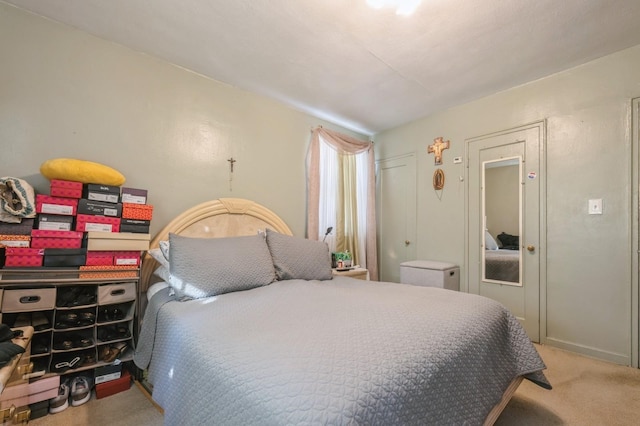 bedroom featuring carpet flooring and baseboards