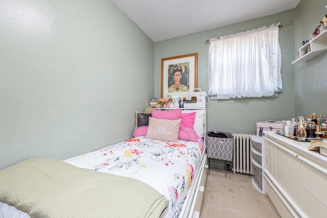 bedroom with light carpet and radiator