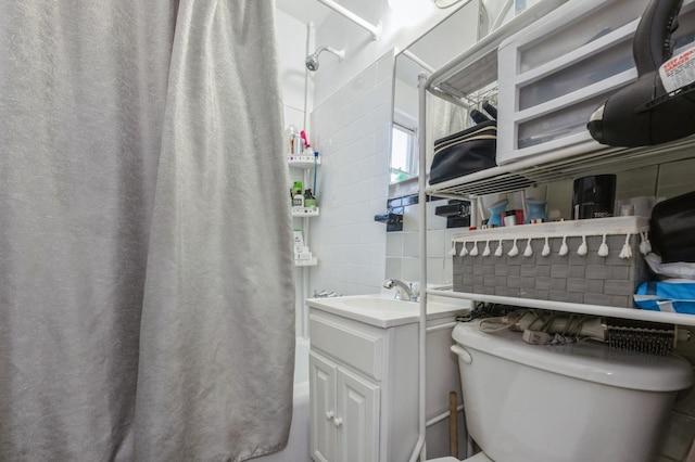 full bathroom with toilet, backsplash, curtained shower, vanity, and tile walls