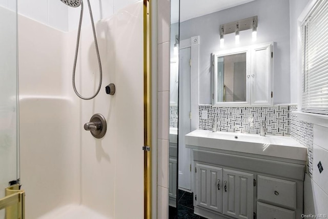 full bathroom featuring a shower stall, tile walls, and vanity