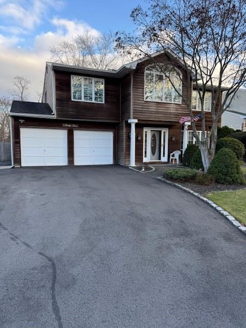 view of front of home featuring driveway and an attached garage