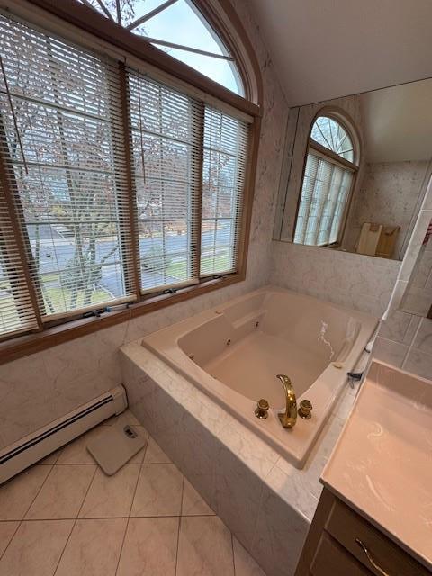 full bathroom with a baseboard radiator, a bath, and tile patterned floors