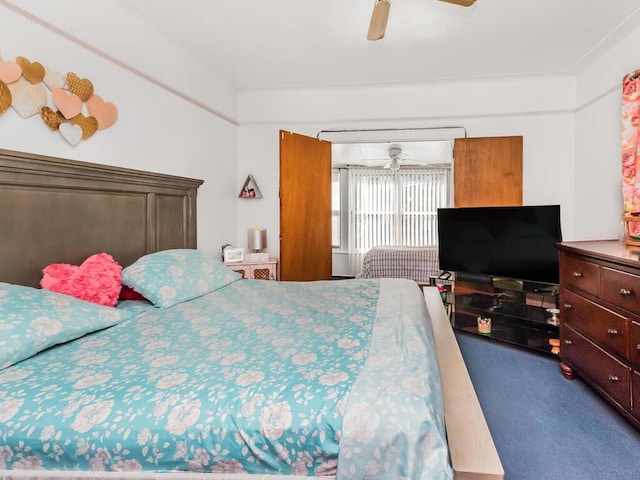 bedroom with ceiling fan and carpet