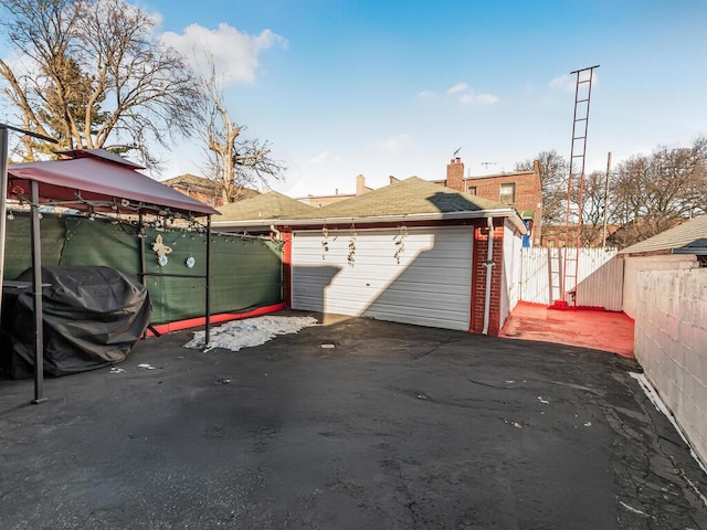 garage featuring fence