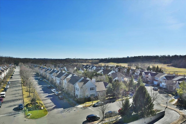 birds eye view of property with a residential view