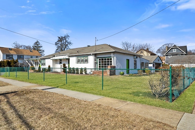 ranch-style home with a fenced front yard and a front yard