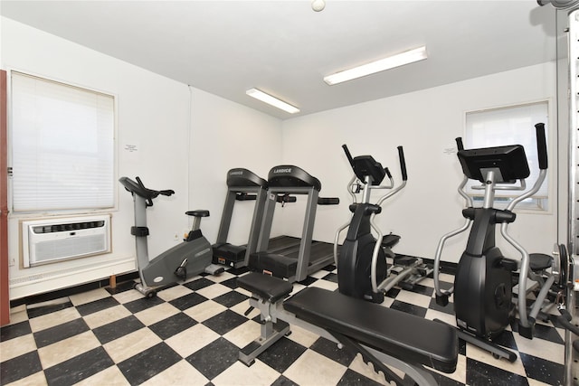 exercise room featuring cooling unit and tile patterned floors