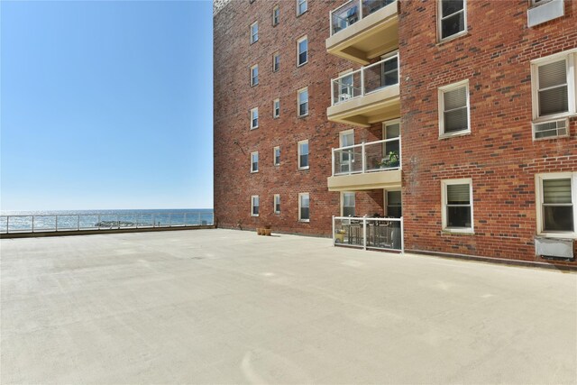 view of building exterior with a water view