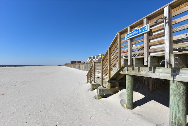 exterior space with a beach view and a water view