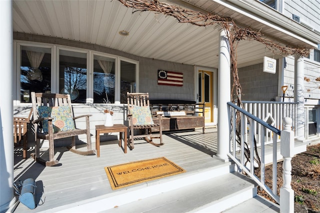 wooden terrace with a porch