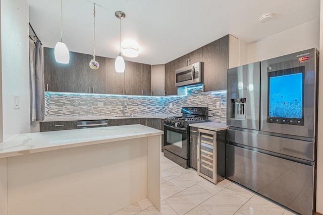 kitchen with light stone counters, beverage cooler, stainless steel appliances, a sink, and backsplash