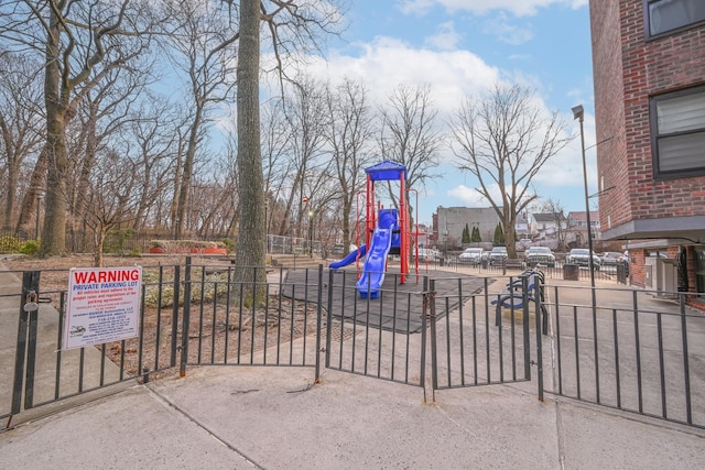 community jungle gym featuring fence