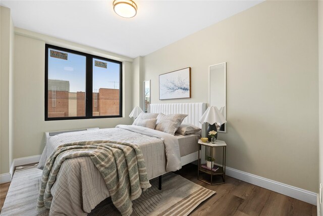 163-07 72nd Ave Unit 2A, Fresh Meadows, NY 11365 - bedroom featuring baseboards and wood finished floors
