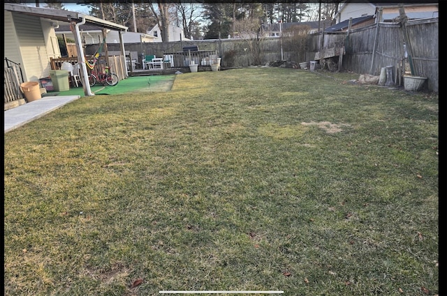 view of yard with a fenced backyard