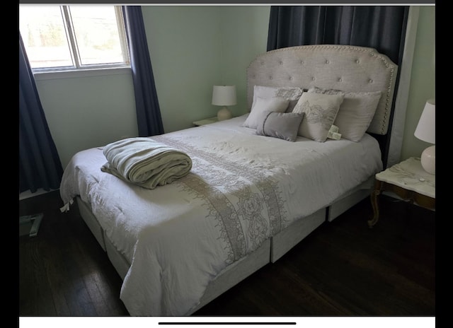 bedroom with wood finished floors