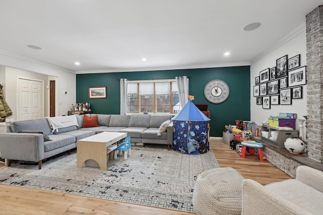 living room with recessed lighting, wood finished floors, and ornamental molding