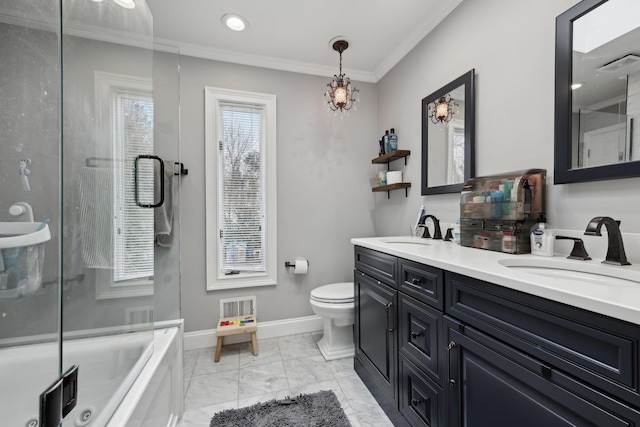 bathroom featuring a sink, visible vents, baseboards, and ornamental molding