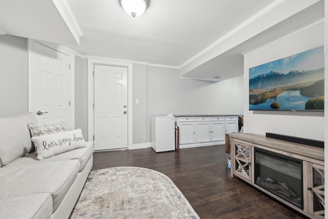 living room with crown molding and dark wood-style flooring