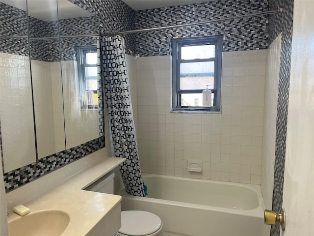 bathroom featuring toilet, vanity, shower / bath combination with curtain, and a wealth of natural light