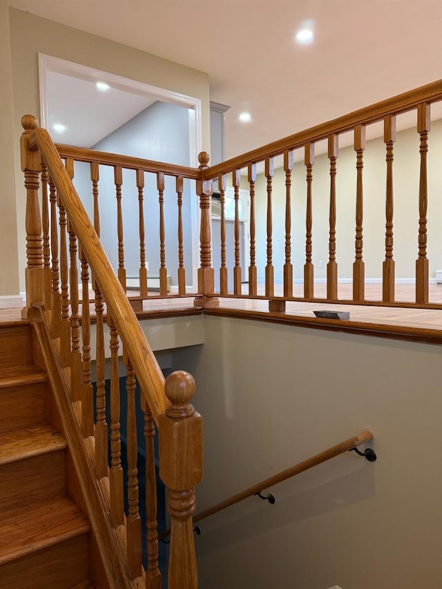 staircase with recessed lighting