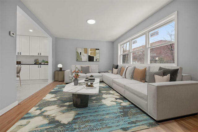 living room with wood finished floors and baseboards