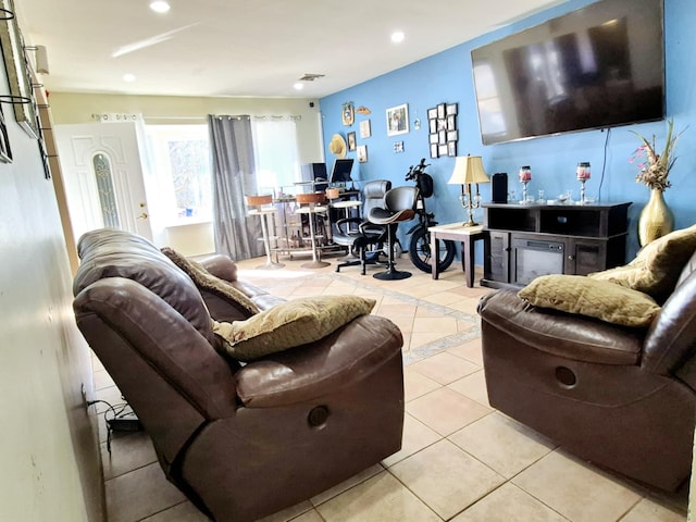 living area with recessed lighting and tile patterned floors