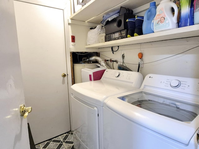 washroom with laundry area and independent washer and dryer