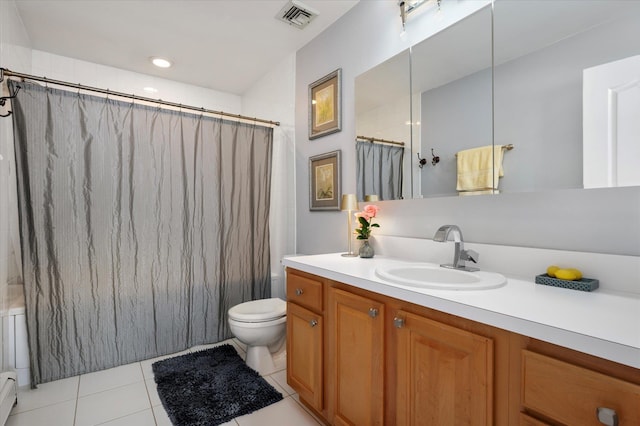 bathroom with tile patterned flooring, visible vents, a baseboard heating unit, toilet, and vanity