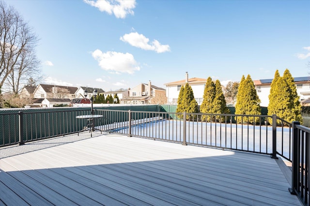 wooden terrace with a residential view