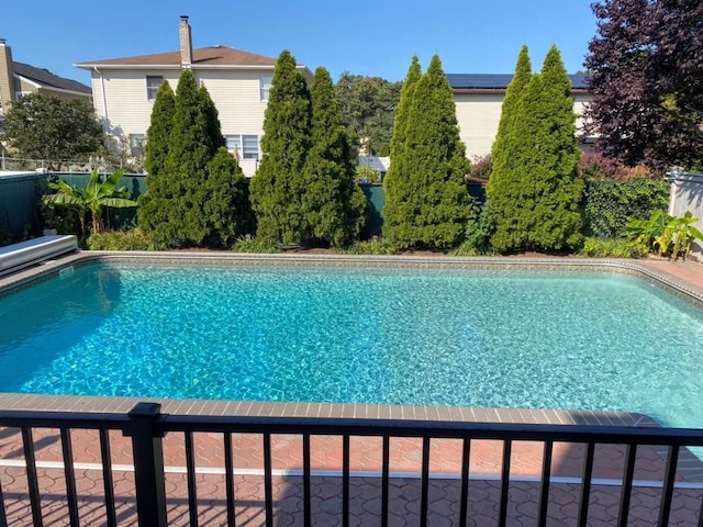 view of pool featuring a fenced in pool and fence