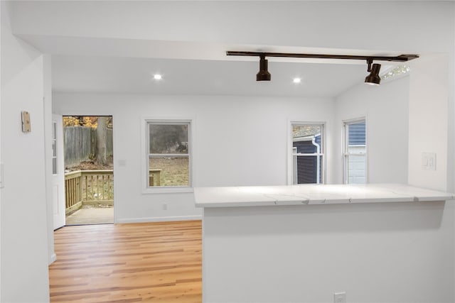 interior space featuring a healthy amount of sunlight, light wood-style flooring, and recessed lighting