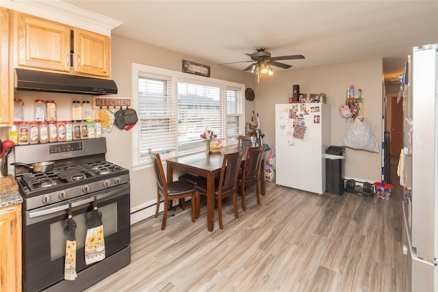 dining area with ceiling fan and light wood-style floors