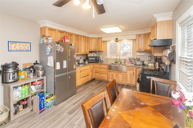 kitchen featuring a ceiling fan, wood finished floors, under cabinet range hood, black appliances, and a sink