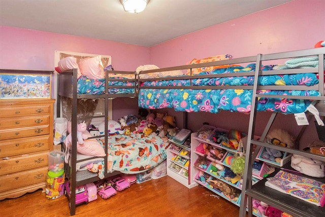 bedroom with wood finished floors