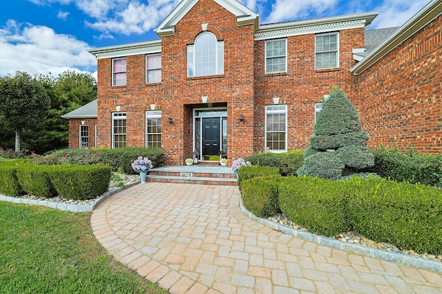 view of front of house featuring brick siding