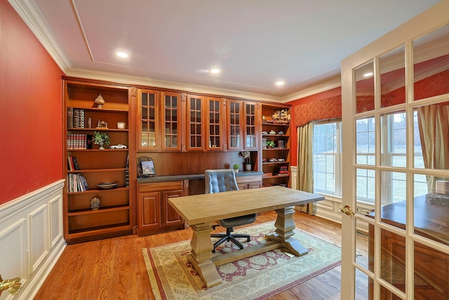 office with crown molding, recessed lighting, a decorative wall, light wood-style floors, and wainscoting