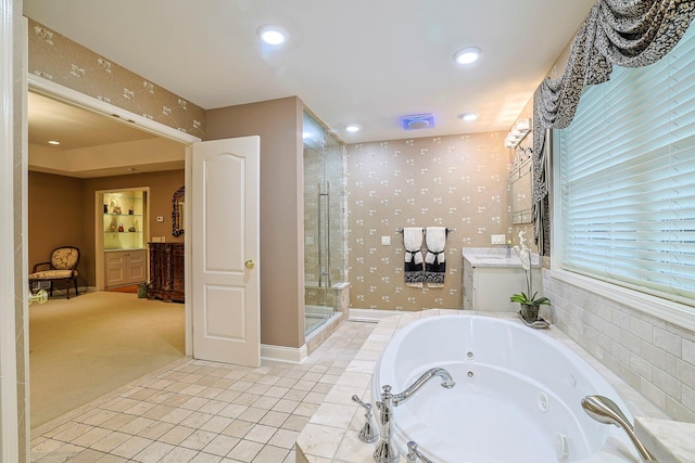 bathroom featuring wallpapered walls, a stall shower, tile patterned floors, a jetted tub, and vanity