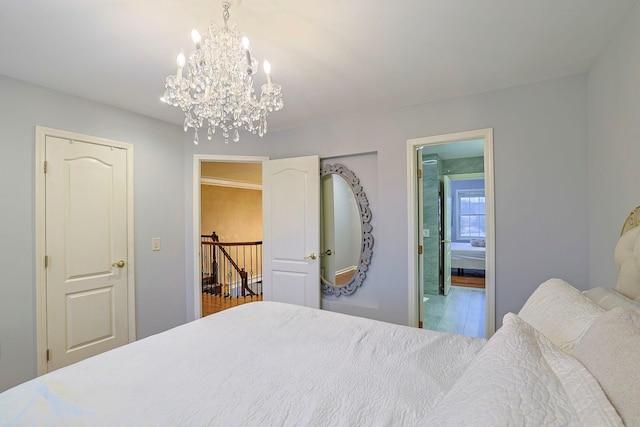 bedroom with a notable chandelier