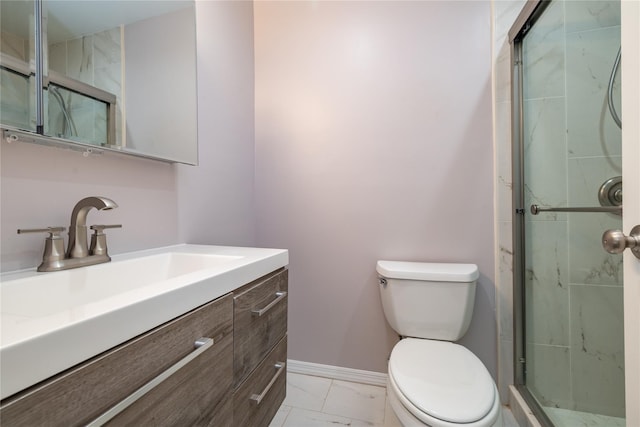 full bath with a stall shower, marble finish floor, vanity, and toilet