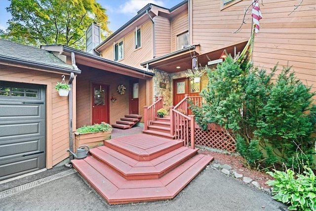 wooden deck with an attached garage