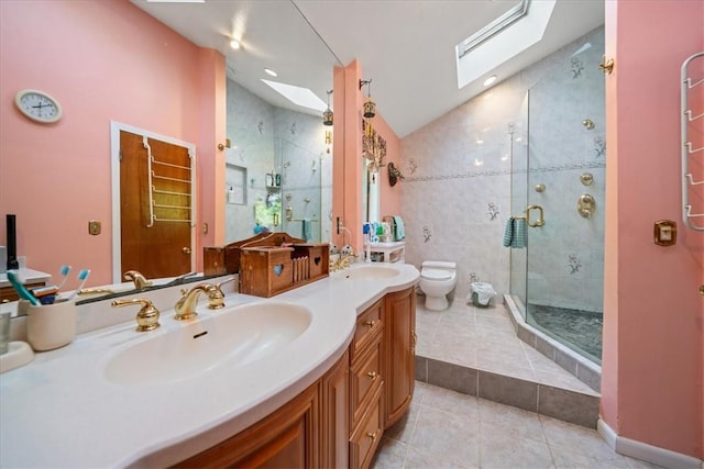 full bath with lofted ceiling with skylight, a sink, a shower stall, and tile patterned floors